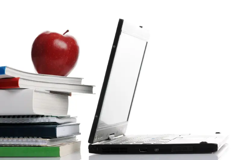 School books and laptop