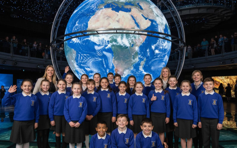 School group exploring the immersive globe at Dynamic Earth, Edinburgh