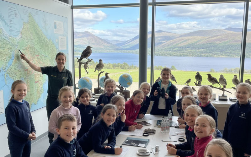 Pupils inside a Lake District visitor centre learning about geography and conservation