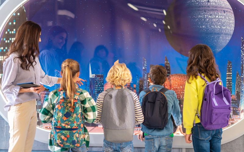 queue of little kids at the Science Museum, UK school trips, December 2024, UK